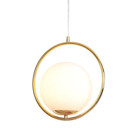 Lampada a sospensione a LED di design con anello dorato e sfera di vetro di lusso